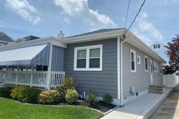 Photo of after with vinyl siding and cedar impressions